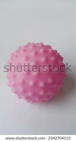 photo of pink ball on white background