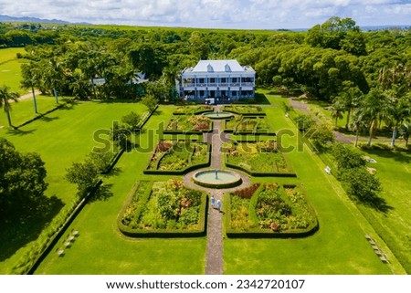 Le Chateau de Bel Ombre Mauritius, an old castle in a tropical garden in Mauritius., a couple on a honeymoon vacation in Mauritius Royalty-Free Stock Photo #2342720107