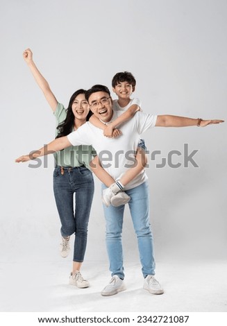 a family posing on a white background Royalty-Free Stock Photo #2342721087