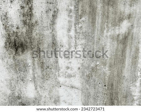 a photography of a fire hydrant in front of a dirty wall, concrete wall with a fire hydrant and a fire hydrant in the middle.