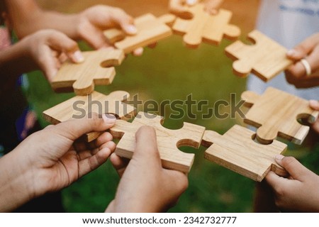 jigsaw puzzle pieces communication teamwork unite power teamwork and unity in hand teamwork concept Royalty-Free Stock Photo #2342732777