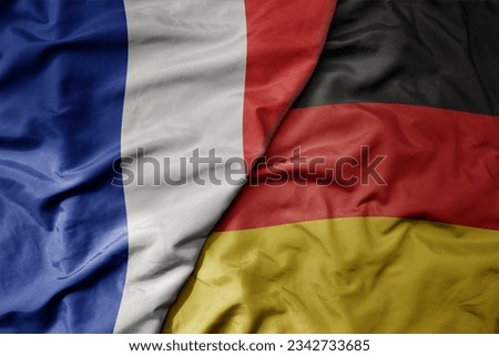 big waving realistic national colorful flag of france and national flag of germany . macro Royalty-Free Stock Photo #2342733685