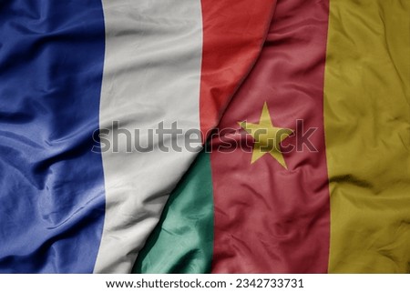 big waving realistic national colorful flag of france and national flag of cameroon . macro