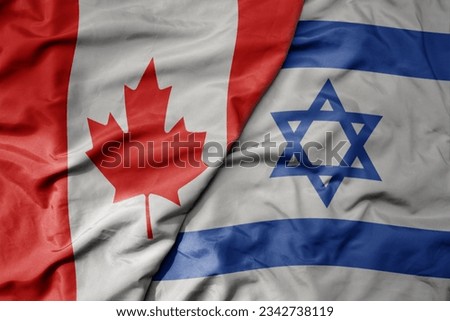 big waving realistic national colorful flag of canada and national flag of israel . macro