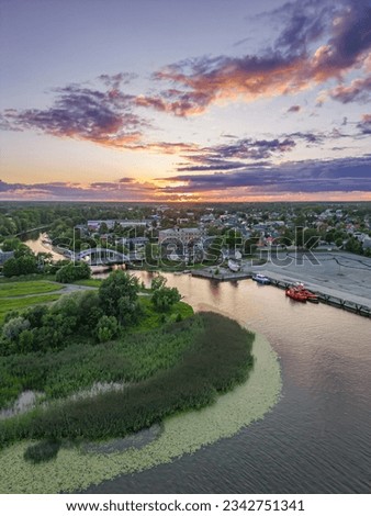 Sunset Serenity: Summer Aerial View of Parnu Jõgi River, Estonia. Vertical shot, portrait shot.