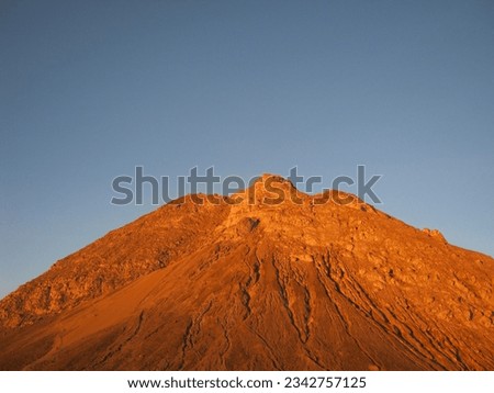 the morning view of the orange peaks of Mount Merapi from the "pasar bubrah". The photo was taken by Willem Tasiam, a marathon climber