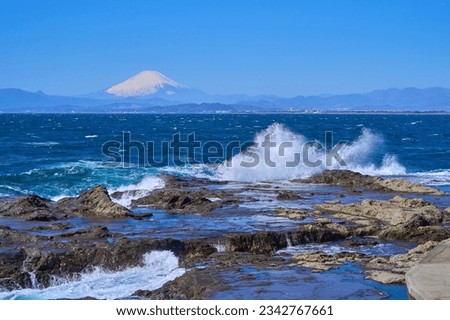 View of Mt. Fuji and the waves crashing against the reef from Chigogafuchi in Enoshima, Fujisawa City, Kanagawa Prefecture                                Royalty-Free Stock Photo #2342767661