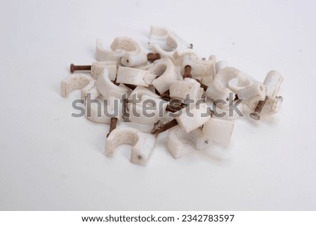 Round cable clips. Isolated background in white. topview. Flat lay photography. rusty