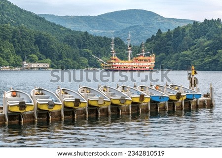 Pleasure boats on Lake Ashi, also know as Hakone Ashinoko Lake, a crater lake in an extinct volcano in Hakone, Japan. 