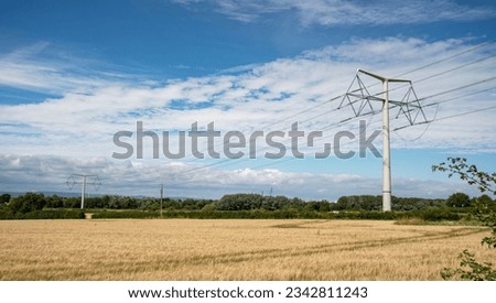 T-Pylons on the new Tickenham to Portishead 400,000 volt overhead electricity line, United Kingdom Royalty-Free Stock Photo #2342811243