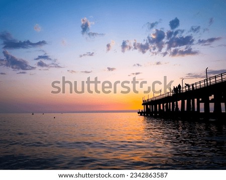 VIew of a pier during the sunset.