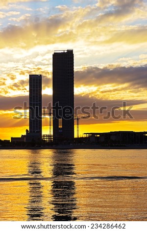 Dramatic sunset over skyscrapers in Miami city, Florida USA. Buildings near the waterfront with bright sunset at the background. 