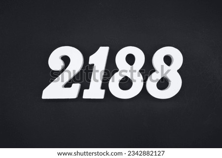 Black for the background. The number 2188 is made of white painted wood.