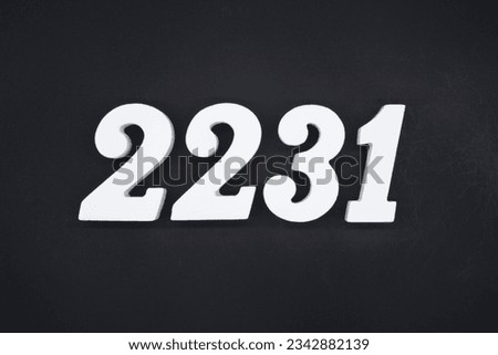 Black for the background. The number 2231 is made of white painted wood.