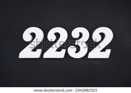 Black for the background. The number 2232 is made of white painted wood.