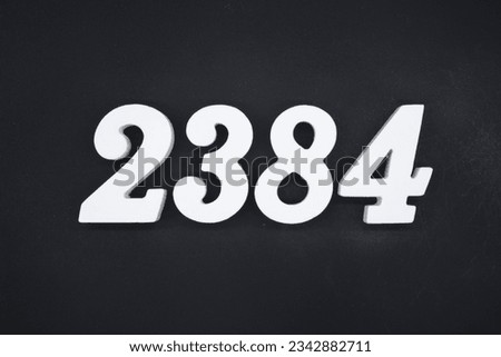 Black for the background. The number 2384 is made of white painted wood.