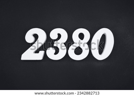 Black for the background. The number 2380 is made of white painted wood.