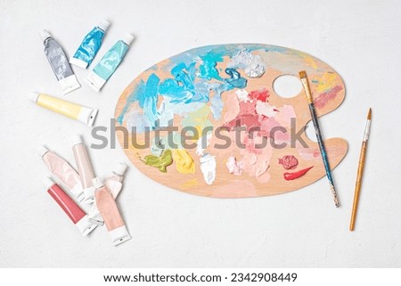 Artist painting palette with brushes. Craft hobby background. Recomforting, destressing hobby, art therapy Royalty-Free Stock Photo #2342908449