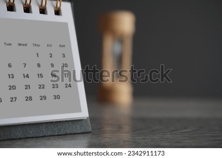 Close up image of calendar and hourglass with copy space. Deadline, time limit and period concept.