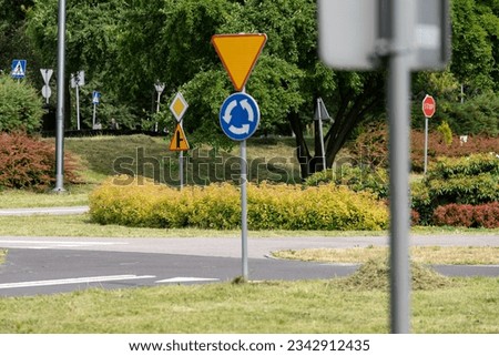 Street with road Signs and Traffic Symbols in Poland.  Bicycle square sign learning area in Poland