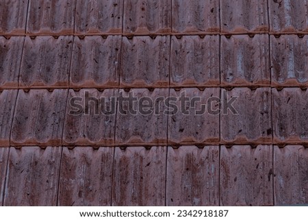 brown ceramic roof tiles close-up