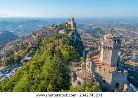 Aerial view of San Marino dominated by Torre Guaita and Torre Cesta. Royalty-Free Stock Photo #2342943291