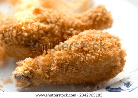 Mouthwatering Close-Up: Savor the Delicious Details of Crispy Fried Chicken in Exquisite 4K