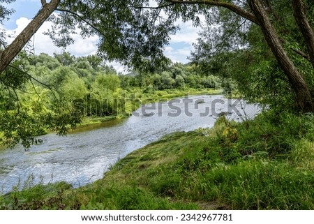 river in the mountains with blue sky, beautiful sunny day in natur