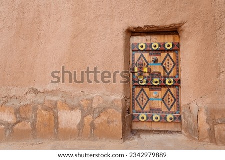 Colorful door of Ushaiger heritage village in Saudi Arabia Royalty-Free Stock Photo #2342979889