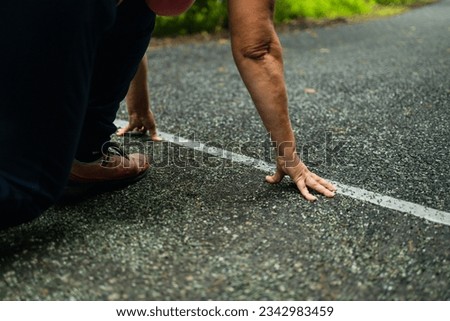 Rear view of a woman getting ready to start on the athletics track. beginning of New Year 2024, planning, goal and new year resolution. High quality photo