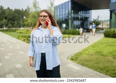 Young Caucasian woman with earphones talking with phone, audio chat and recording conversation on 5g digital connection.. High quality photo