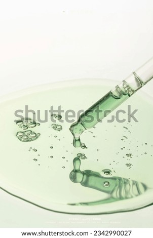 Dropper Liquid essence Light Green Bubble Scientific Skin Care Utensils Dropper Royalty-Free Stock Photo #2342990027