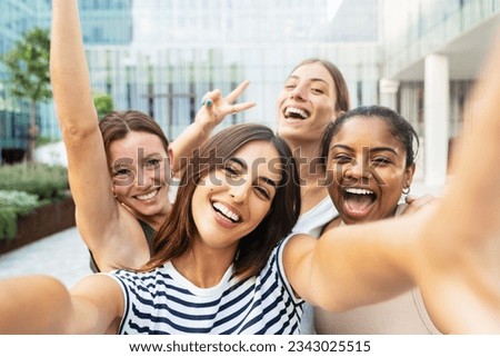 Four cheerful girls friends taking a selfie photo in the city - Female Students at University Campus