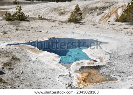 Blue Star spring in Old Faithful Basin of Yellowstone National Park Royalty-Free Stock Photo #2343028103