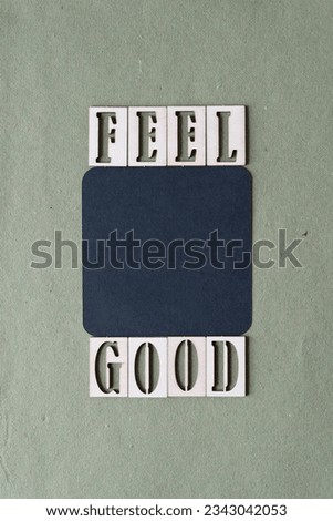 machine-cut rounded corner square with stencil-like wooden letter cutouts and the message "feel good"