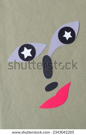 starry eyed character or cartoon with red lips and small mustachio 