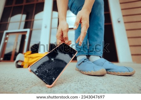
Woman Dropping her Phone on the Floor Breaking the Display. Stressed person picking up the broken smartphone she dropped 
 Royalty-Free Stock Photo #2343047697