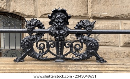 Old Metal structure of dragons and man on a old building in New York City. On the building The Dakota.  Royalty-Free Stock Photo #2343049631