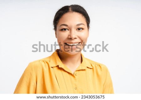 Portrait of beautiful smiling confident African American woman looking at camera. Smart successful university student isolated on white background	