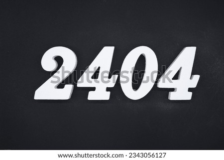Black for the background. The number 2404 is made of white painted wood.