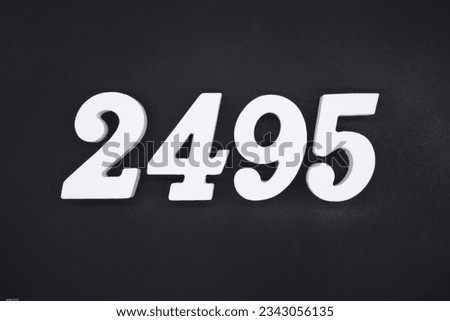 Black for the background. The number 2495 is made of white painted wood.