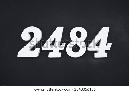Black for the background. The number 2484 is made of white painted wood.