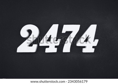 Black for the background. The number 2474 is made of white painted wood.