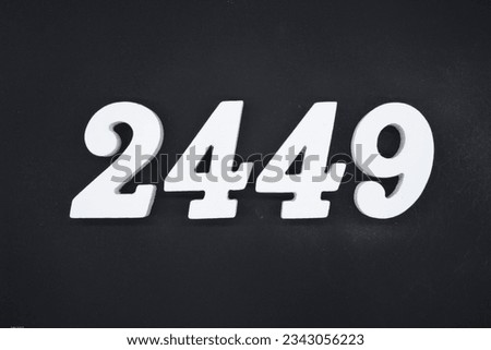Black for the background. The number 2449 is made of white painted wood.