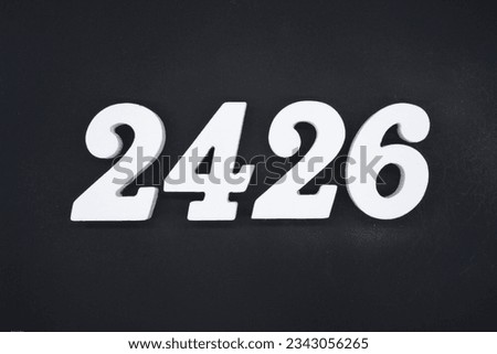 Black for the background. The number 2426 is made of white painted wood.