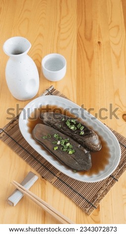 Japanese side dish. Boiled eggplant and sake.
