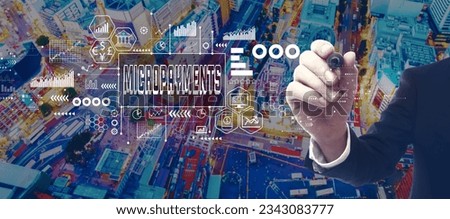 Micropayments theme with businessman in a city at night Royalty-Free Stock Photo #2343083777