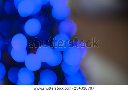 Blurred abstract Christmas blue light background.