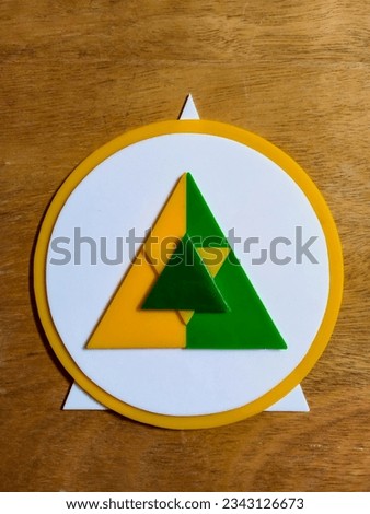 Bandung, Agt 6, 2023 : Creative concept colorful art of Combination triangle and circle shape from plastic props that regular arranged on wooden triplek background.