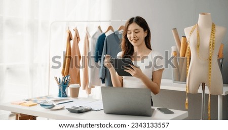 Young Asian woman running online store Startup small business SME, using smartphone or tablet taking receive and checking online purchase shopping order

 Royalty-Free Stock Photo #2343133557